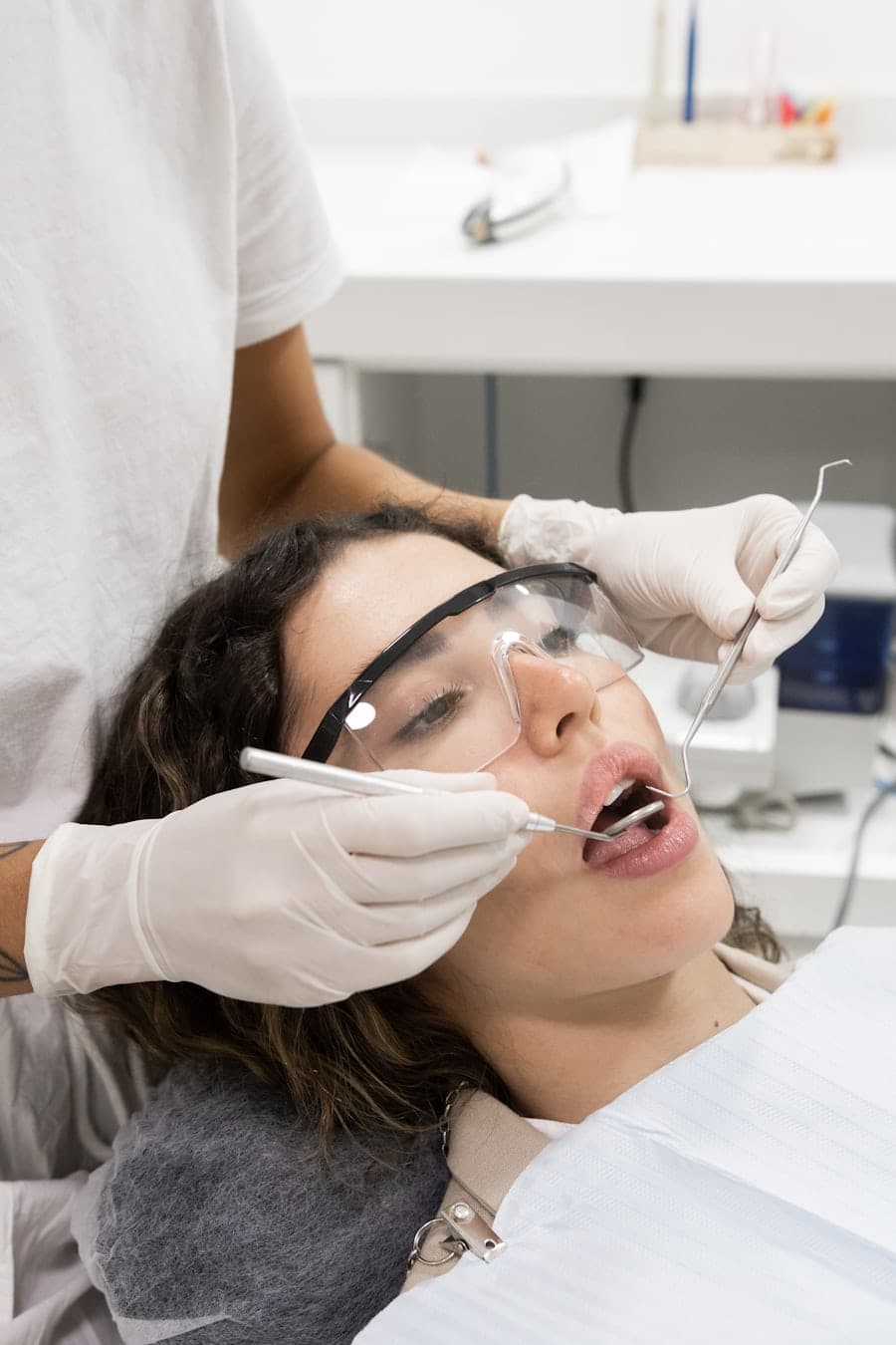 Close up of a person smiling brightly with clear aligners